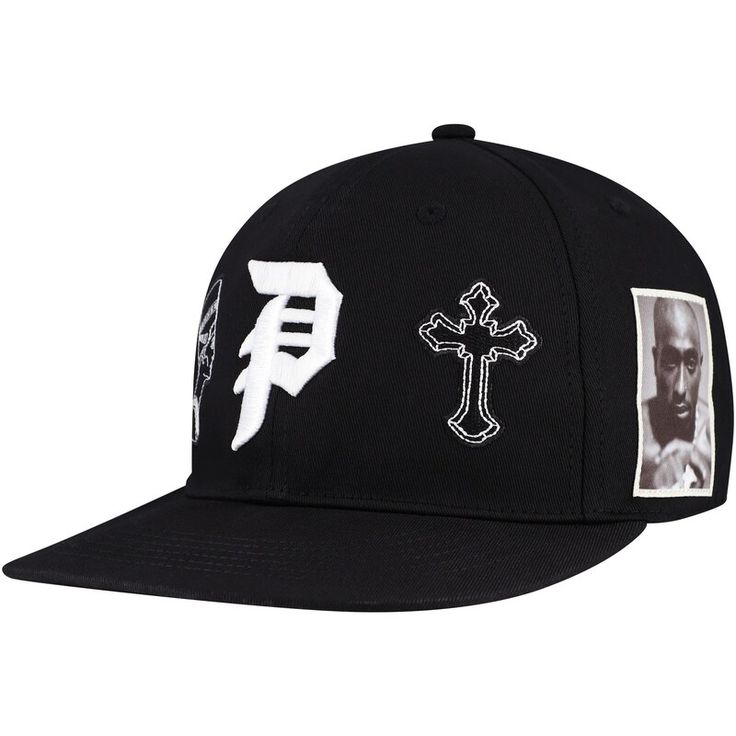 Represent one of hip-hop's most influential figures with this Tupac Shakur Royalty Snapback Hat. It features raised embroidery on the front crown and a wordmark logo on the back, making it instantly recognizable to fans of the hip-hop legend. This snapback also has a structured fit and a flat bill for a classic look. Fitted Hat With Letter Patch For Baseball Season Streetwear, Black Snapback Hat With Flat Crown For Streetwear, Flat Brim Fitted Hat With Letter Patch For Streetwear, Black Hat With Logo Print And Flat Brim, Streetwear Snapback Fitted Hat With Letter Patch, Streetwear Fitted Snapback Hat With Letter Patch, Adjustable Hip Hop Hat For Streetwear, Black Baseball Cap With Logo For Streetwear, Black Logo Print Baseball Cap For Streetwear