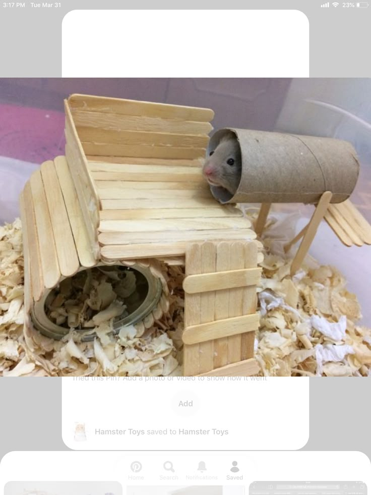 an image of a mouse in a house made out of wood shavings and paper