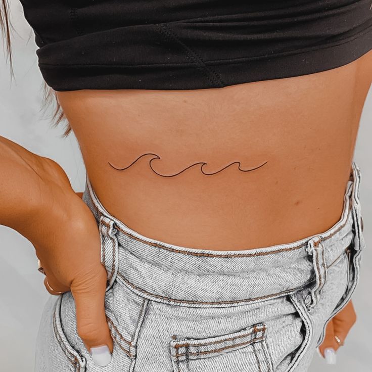 Minimalist wave fine line tattoo ribs Wave Tattoo Simple Ribs, Wave Tattoo Under Bra Line, Rib Wave Tattoo, Beach Rib Tattoo, Wave Tattoo Thigh, Wave Tattoo Ribs, Fine Line Beach Tattoo Ideas, Wave Fine Line Tattoo, Ride The Wave Tattoo