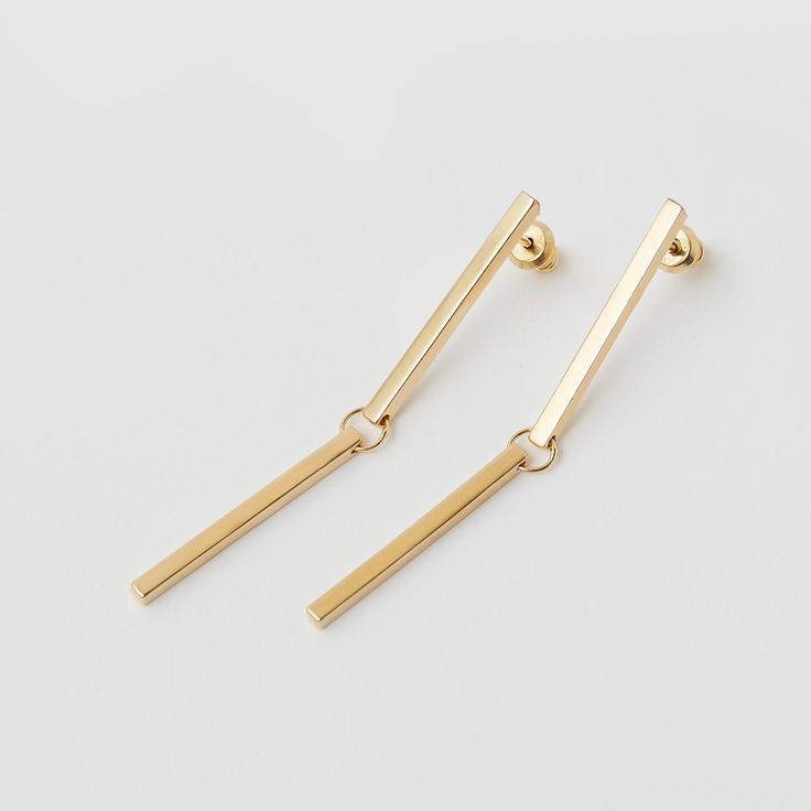 The line is an everyday earring evoking the beauty of simple geometry. made in sterling silver and gold vermeil they measure 5 cm x 0.15 cm hand made in Queens NY lead time is two weeks, email hello@sunabonometti.com if you need them sooner Minimalist Metal Threader Earrings, Minimalist Long Drop Tarnish Resistant Earrings, Minimalist 14k Gold Linear Earrings, 14k Gold Minimalist Linear Earrings, Minimalist Dangle Linear Earrings, Minimalist Silver Linear Earrings In Brass, Minimalist Linear Earrings As Gift, Minimalist Gold Long Drop Earrings, Minimalist Metal Linear Drop Earrings