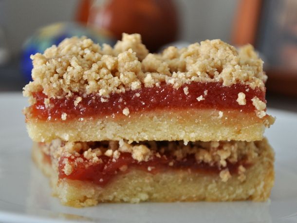 two pieces of cake sitting on top of a white plate with crumbs all over it