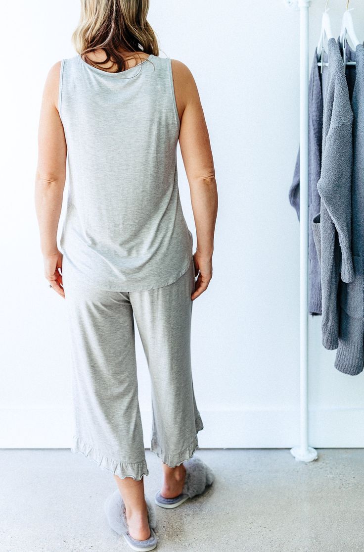 This luxury two piece loungewear set is cozy, comfortable & buttery. soft. Wear as pajamas or loungewear. Made from silky-soft sustainable bamboo for all the comfort. Our sleepwear looks elegant, feels luxurious and is cooling, phenomenally soft, and ultra-comfortable. Cropped jogger bottoms feature a pretty ruffle hem detail making them the perfect length for any height. A drawstring waist tie allows adjustment for just the perfect fit. Matching tank with small pocket makes an adorable pair. Re Comfy Sleepwear With Soft Texture For Relaxation, Soft Sleepwear Long Pants For Relaxation, Super Soft Comfy Sleepwear For Relaxation, Comfy Sleepwear With Soft Texture For Loungewear, Comfy Soft Sleepwear For Loungewear, Comfy Super Soft Sleepwear For Relaxation, Super Soft Cotton Sleepwear For Loungewear, Soft Spring Sleepwear For Loungewear, Relaxed Fit Modal Sleepwear For Relaxation