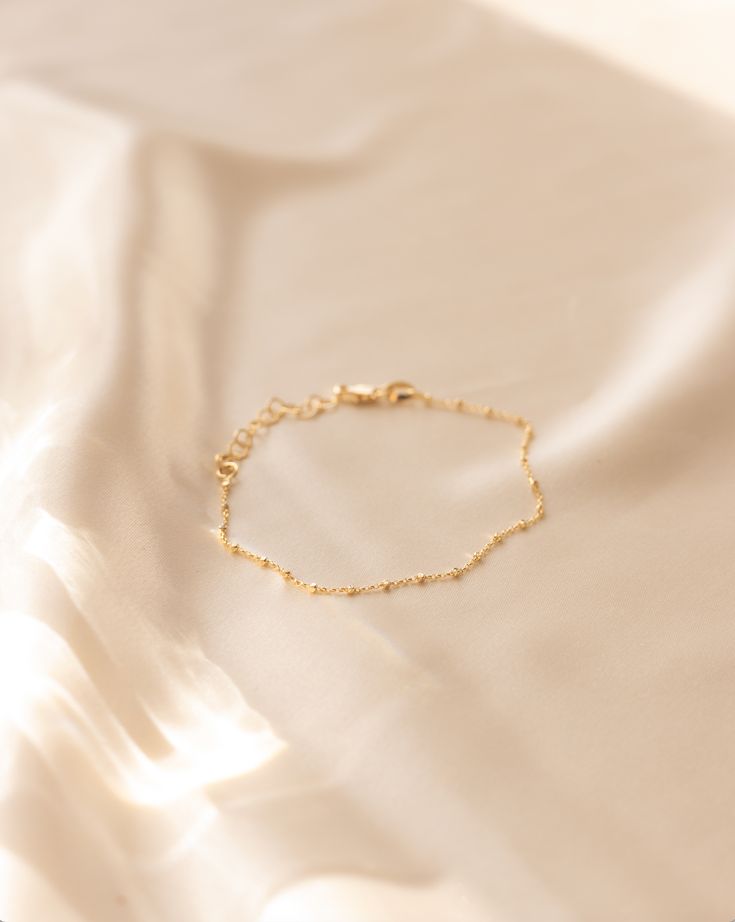 Introducing the Camilla Bracelet - the dazzling addition to your accessory collection! Perfect for stacking with other wrist candy, this bracelet brings a touch of sparkle to any outfit. Don't miss out on this must-have piece for your jewelry collection! Details: - Gold filled - 6" length with 1" adjustment - Hypoallergenic & Waterproof Adjustable Dainty 14k Gold-filled Bracelet, Dainty Adjustable 14k Gold Filled Bracelet, Chic Adjustable Gold Bracelet For Gift, Chic Adjustable Tarnish Resistant Bracelet, Chic Adjustable Tarnish-resistant Bracelet, Adjustable Delicate 14k Gold-filled Bracelets, Gift Bracelets With Adjustable Chain In 14k Gold Filled, Adjustable Dainty Gold Bangle Bracelet, Everyday Metal Bracelets With Extender