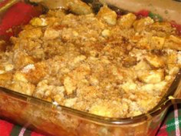 a casserole dish filled with stuffing on top of a table