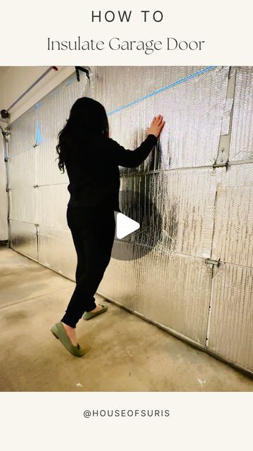 a woman standing in front of a garage door with the words how to insulate garage door