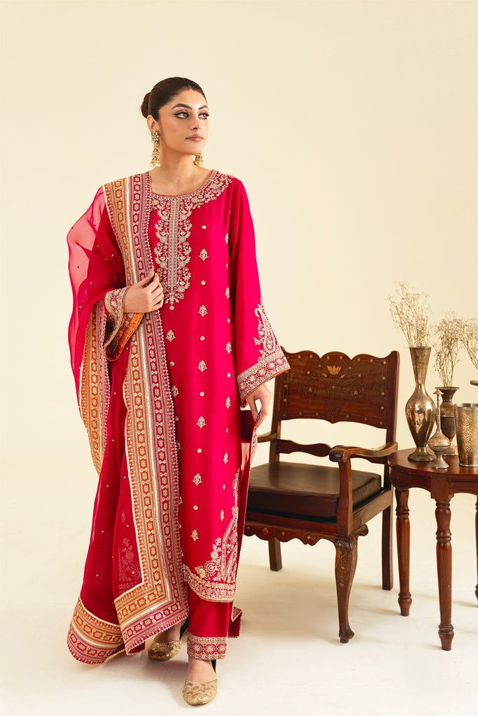 Rouge Red Raw Silk Churidar With Gota Work, Transitional Pink Churidar With Sheer Dupatta, Red Raw Silk Salwar Kameez With Sheer Dupatta, Silk Churidar With Gota Work For Eid, Pink Kurta With Gota Work And Traditional Drape, Pink Traditional Churidar For Transitional Season, Transitional Pink Churidar With Traditional Drape, Pink Silk Traditional Wear With Gota Work, Red Dola Silk Kurta With Sheer Dupatta