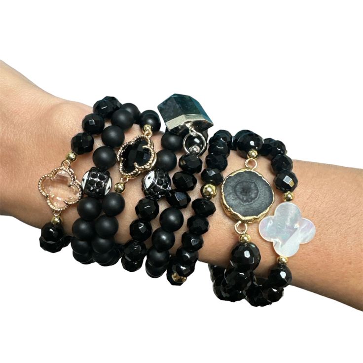 Dress up your wrist with this trendy Black Beaded Bracelet Stack. Perfect for any outfit and occasion, these black beads add a touch of elegance while still maintaining a playful edge. The stackable design allows for versatile styling options, making it a must-have accessory for any fashion-forward individual. Beaded Bracelet Stack, Black Beaded Bracelet, Vegan Tote Bag, Starburst Necklace, Black Beaded Bracelets, Hamsa Necklace, Black Bracelet, Jewelry Essentials, Black Bracelets