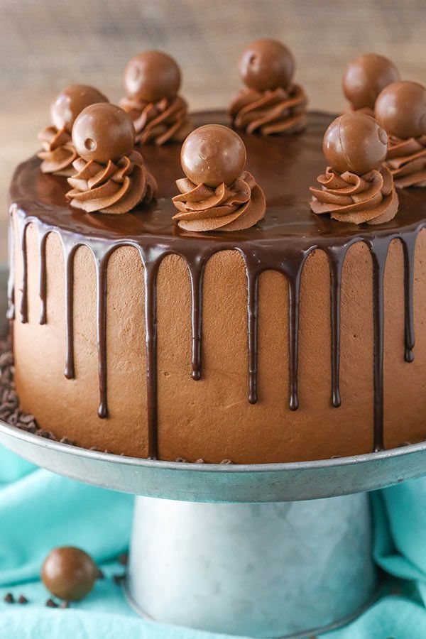 a cake with chocolate frosting and decorations on top