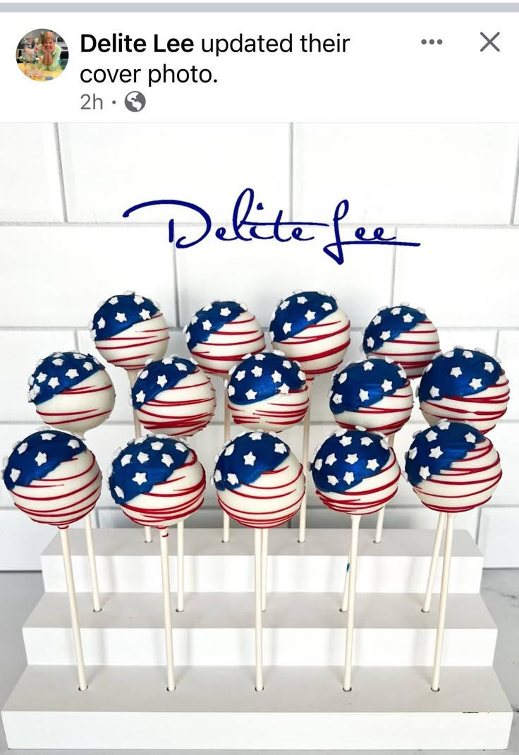 red, white and blue cake pops are arranged on a stand with the words delite lee updated their cover photo