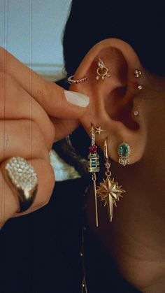 Ear Piercing Two Holes, Super Pierced Ears, Folded Ear Piercing, Curated Piercing Ideas, Earring Layering Ideas, Ear Party Inspiration, Beautiful Ear Piercings, Colorful Ear Curation, Gold Earring Arrangement