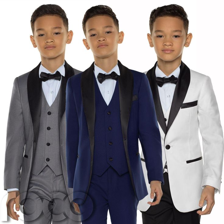 three young boys in tuxedos and bow ties standing next to eachother