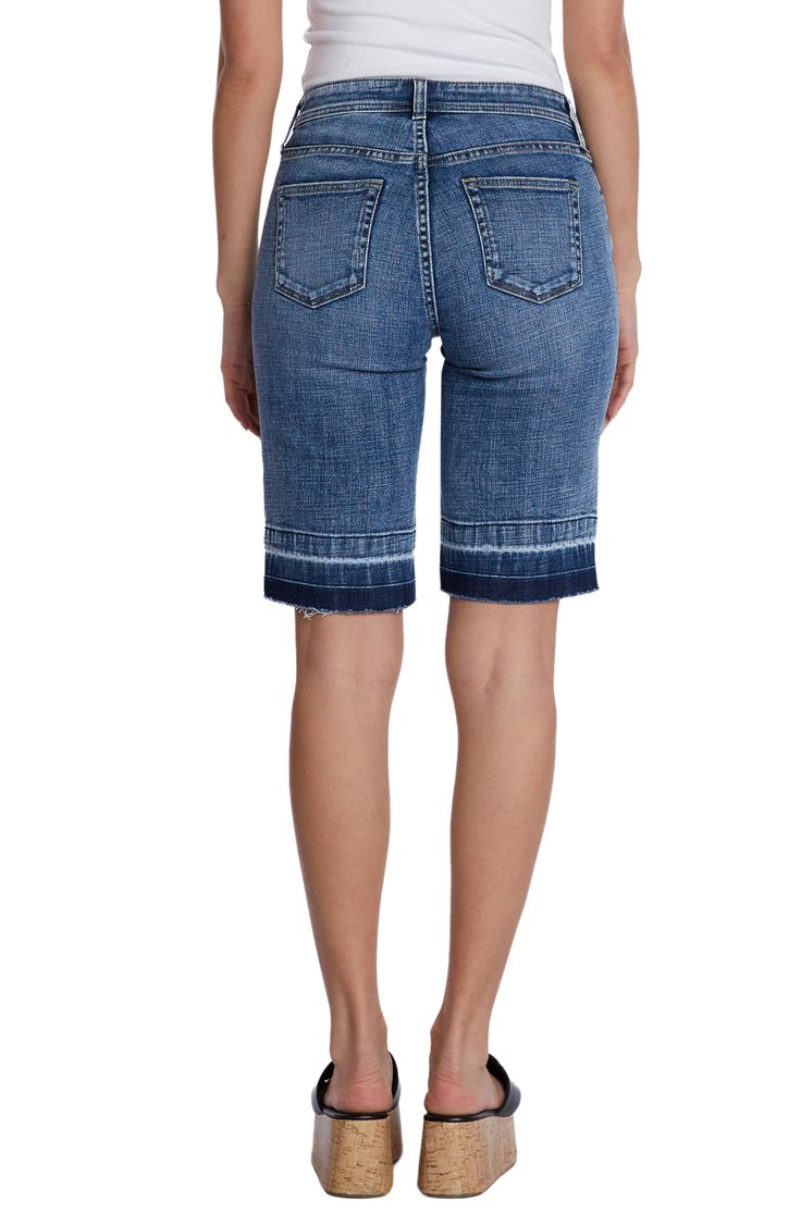 Partially made with sustainably sourced fibers, these stretchy Bermuda shorts feature a relaxed fit and released hems that create a modern silhouette. 11" inseam; 19" leg opening; 10 1/2" front rise Zip fly with button closure Five-pocket style 69% cotton, 27% REPREVE® recycled polyester, 3% rayon, 1% spandex REPREVE recycled polyester is made from 100% post-consumer recycled plastic bottles Machine wash, tumble dry Imported Fitted Denim Bermuda Shorts In Medium Wash, Fitted Medium Wash Denim Bermuda Shorts, Summer Stretch Denim Bermuda Shorts, Stretch Mid-rise Cotton Bermuda Shorts, Stretch Denim Bermuda Shorts For Summer, Stretch Denim Knee-length Shorts, Casual Stretch Bermuda Shorts In Medium Wash, Casual Stretch Medium Wash Bermuda Shorts, Dark Wash Relaxed Fit Bottoms In Short Length