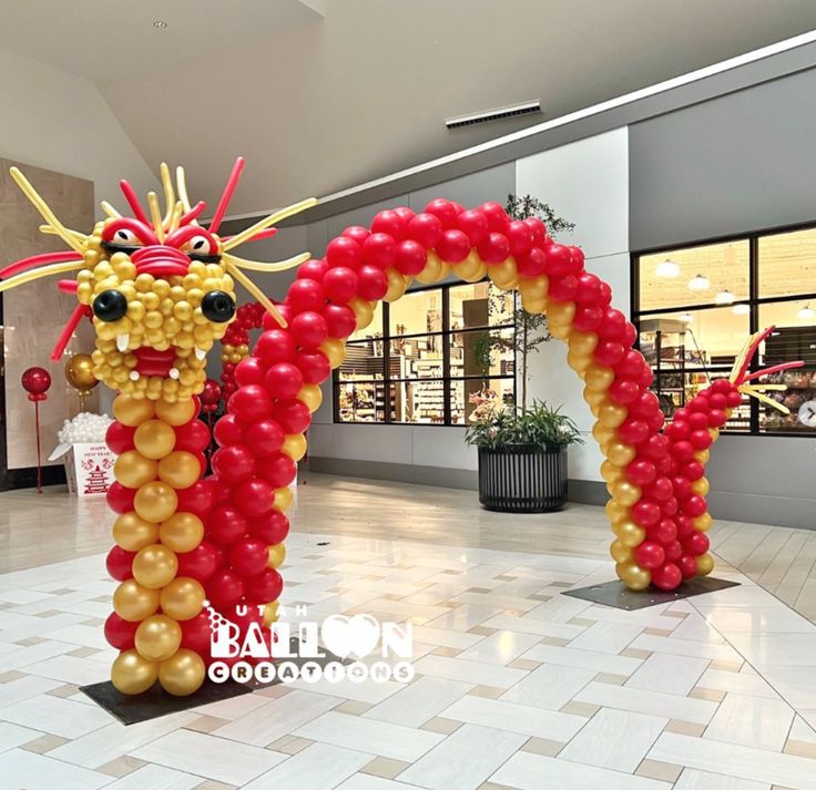 an inflatable dragon is on display at the mall