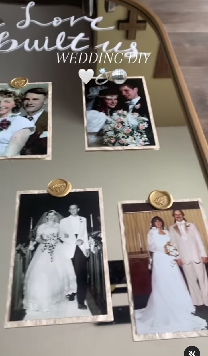 the wedding photos are hanging on the wall