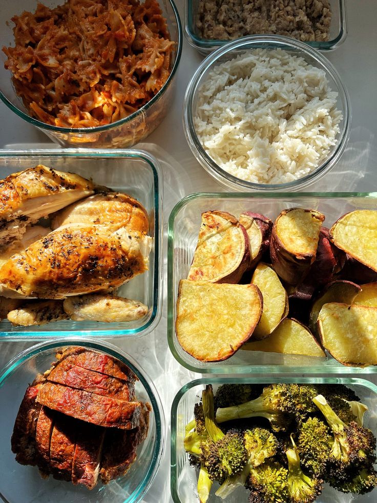 four glass containers filled with different types of food