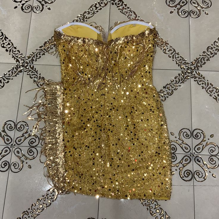 The Bodycon Dress is suitable for party. cocktail. clubbing. date night. wedding. night out. evening. birthday. dinner. celebrity and so on as you like. This Dress is sure to turn heads at any occasion!Our Style No.HT2726Custom Sequin Embroidered FabricMade in China Sleeveless Mini Dress For Gala, Gold Mini Dress For Cocktail Evening, Glamorous Gold Mini Dress For Evening, Sleeveless Sequin Mini Dress For Gala, Sleeveless Evening Dress For Gala Night Out, Sleeveless Sequin Dress For Cocktail Gala, Flirty Sleeveless Evening Dress For Party Season, Sleeveless Bodycon Dress For Prom Season Date Night, Sleeveless Mini Dress For Prom Night Out