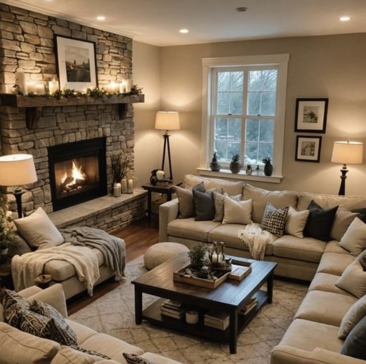 a living room filled with furniture and a fire place in the middle of the room