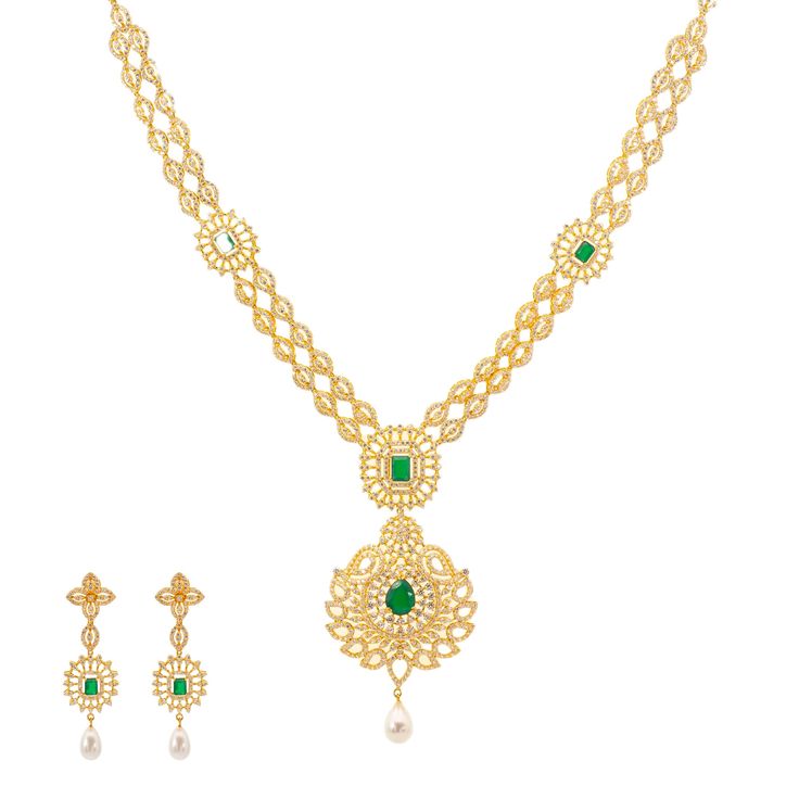 Our Jaya Jewelry set is simply breathtaking. The 22k yellow gold design is decorated with a stunning arrangement of emeralds, cubic zirconia stones, and pearls. It's the perfect 22k yellow gold Indian bridal necklace set for a blushing bride who wants to shimmer and shine with radiance on her special day. Features: • 22k yellow gold • Emeralds • Cubic Zirconia • PearlsThe Indian bridal jewelry collection from Virani Jewelers features a dazzling assortment of precious gemstones, pearls, and of co Indian Bridal Necklace, Womens Evening Wear, 22k Gold Necklace, Bridal Necklace Set, Blushing Bride, Bridal Jewelry Collection, Shimmer And Shine, Gold Bead Necklace, Bridal Jewellery Indian