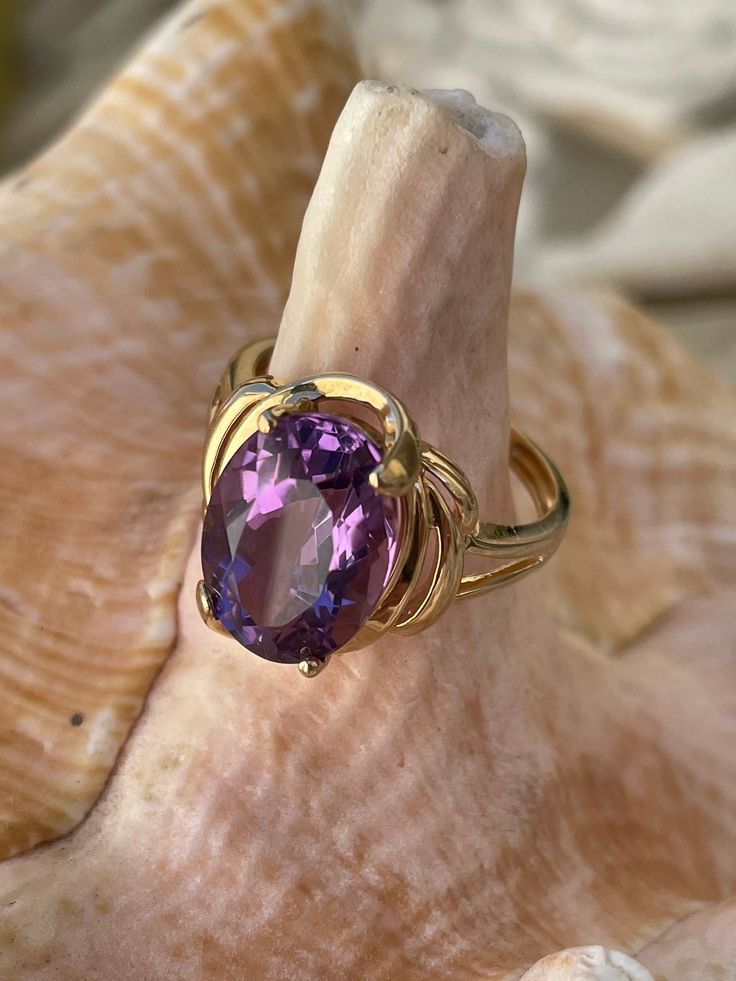 Vintage 14k yellow gold ring engagement ring promise ring with 8 ct faceted amethyst cabochon size 8 3/4 US circa 1980's. Such a beautiful ring. Hallmarked 14k and the amethyst is in great condition such a lovely ring that can make a lady very happy. Gold Amethyst Ring With Cabochon Cut, Elegant Yellow Gold Cabochon Amethyst Ring, Vintage Yellow Gold Hallmarked Amethyst Ring, Vintage Gold Amethyst Cabochon Ring, Vintage Purple Amethyst Cabochon Ring, Gold Ring Engagement, Victorian Gold, Amethyst Gem, Purple Band