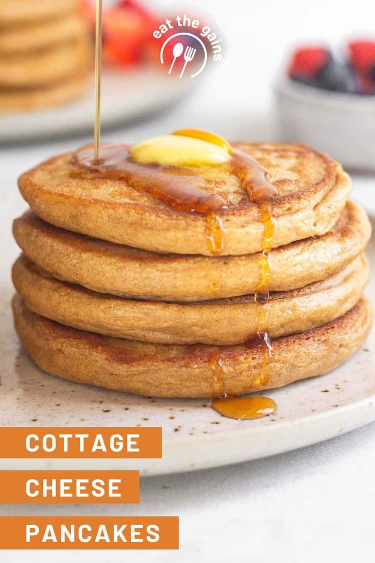 a stack of pancakes on a plate with syrup drizzled over them