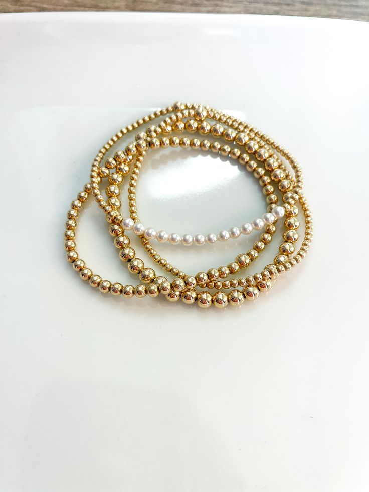 Dainty 14k Gold-filled Beaded Bracelets, Everyday Gold Stackable Beaded Bracelets, Everyday Stackable Gold Beaded Bracelets, Dainty Gold Stackable Bracelets, Dainty 14k Gold Stackable Beaded Bracelets, Delicate 14k Gold-filled Bracelets With Gold Beads, Dainty Stackable 14k Gold Beaded Bracelets, Dainty Stackable Beaded Bracelets In 14k Gold, Dainty Stackable 14k Gold-filled Bracelets