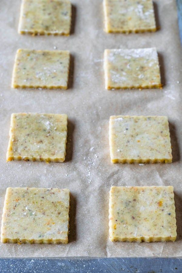 six crackers sitting on top of a cookie sheet