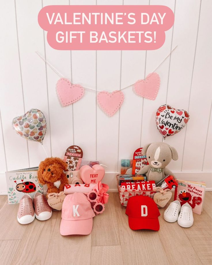 valentine's day gift baskets with teddy bears and other items on the floor in front of a white wall