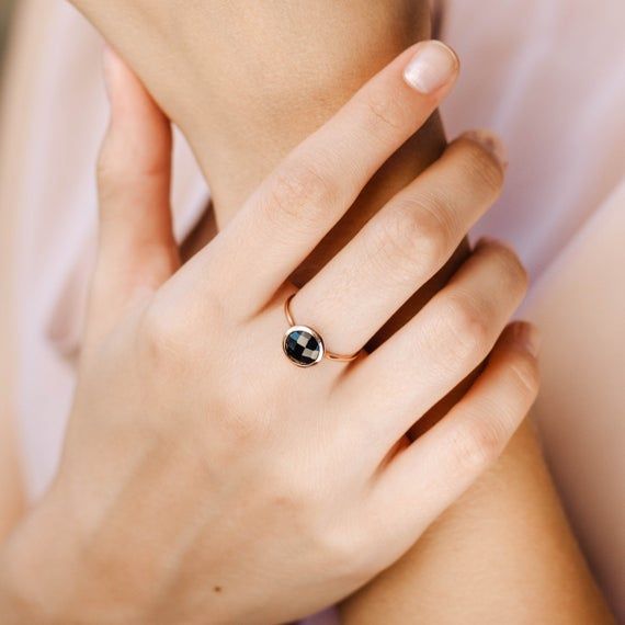 Black onyx 14K gold ring. A dainty, delicate black onyx gemstone ring, ideal for stacking for every woman who loves elegance. An excellent choice for anniversary gift or birthday gift for her. 100% handcrafted with love!D E T A I L S● Metal: 14K solid gold, 14K white gold or 14K rose gold● Gemstone: Black Onyx, briolette cut● Stone Diameter: 8mm (0.31in), 10mm (0.4in) and 12mm (0.5in) R I N G ∙ S I Z I N GFor General Reference:● we use standard US Ring Sizing● an average women's ring finger is s Black Birthstone Jewelry For Promise Ring, Everyday Black Sterling Silver Signet Ring, Black Birthstone Rings, Yellow Gold Black Spinel Jewelry As A Gift, White Gold Onyx Rings For Gift, Round Black Enamel Diamond Ring For Anniversary, Modern 14k Gold Enamel Round Ring, Fine Onyx Jewelry For Anniversary, Black Birthstone Ring Gift