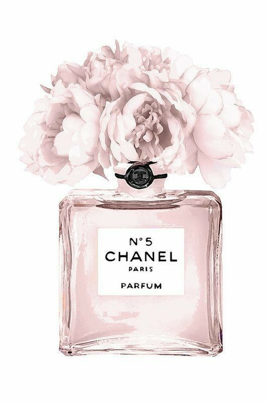 a chanel perfume bottle with flowers on the top and bottom part of it's label