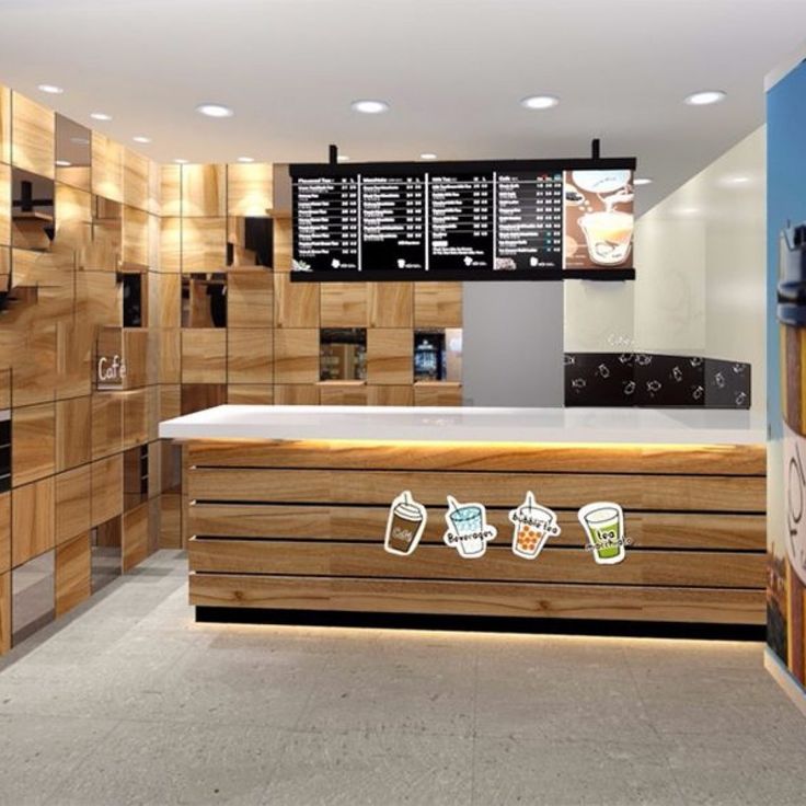 an empty counter with stickers on it in a room filled with wooden cabinets and counters