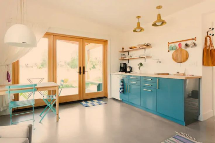 the kitchen is clean and ready to be used as a dining room or living room