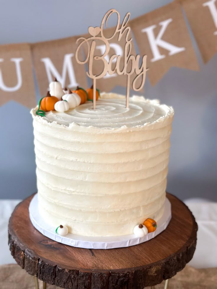 a white cake sitting on top of a wooden table