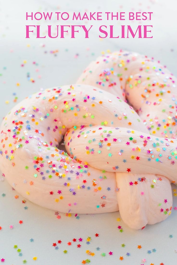 a doughnut covered in white frosting and sprinkles with the words how to make the best fluffy slime