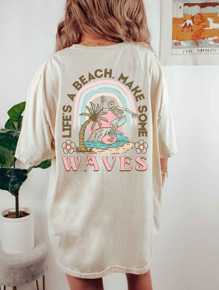 Life's A Beach Shirt. Design on the back only. Printed on Comfort Colors Tee. Must size up for oversized look. See size chart for measurements. Comfort Colors® 1717 Medium fabric (6.1 oz/yd² (206.8 g/m²)) Relaxed fit Sewn-in twill label 100% ring-spun cotton Gildan is back with its garment-dyed t-shirt, a fully customizable tee made 100% with ring-spun cotton. The soft-washed, garment-dyed fabric brings extra coziness to your wardrobe while the relaxed fit makes it an excellent daily choice. The Relaxed Fit Long Sleeve Beach T-shirt, Soft-washed Long Sleeve T-shirt For Summer, Long Sleeve Graphic Print T-shirt For Vacation, Long Sleeve Graphic T-shirt For Vacation, Graphic Print Long Sleeve T-shirt For Vacation, Graphic Print Relaxed Fit Summer Shirt, Oversized Graphic Print Beach Shirt, Oversized Graphic Print Shirt For Beach, Oversized Long Sleeve T-shirt For Vacation