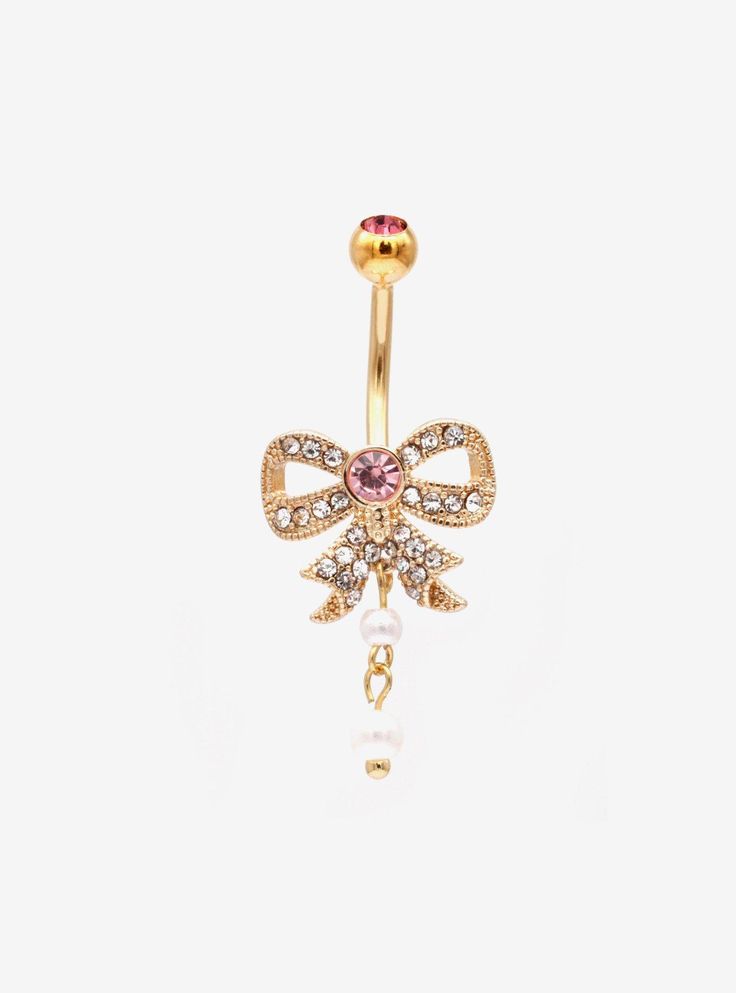 a gold belly ring with pink and white stones