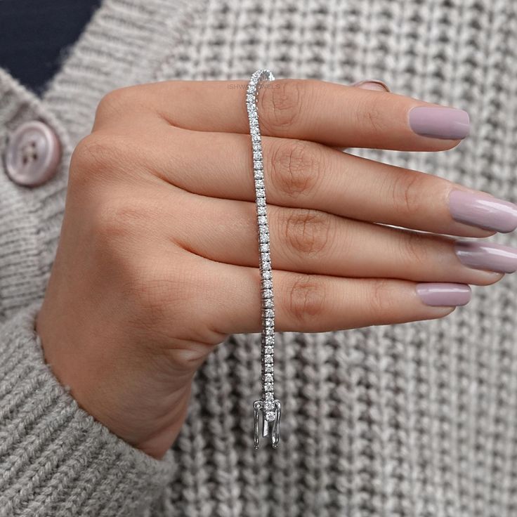 14K White Gold Tennis Bracelet / Round Diamond Women's Wedding Bracelet / Delicate Eternity Prong Set Bracelet / Anniversary Gifts For Her ✯✯ 𝐏𝐫𝐨𝐝𝐮𝐜𝐭 𝐃𝐞𝐭𝐚𝐢𝐥𝐬 ✯✯ ✑ 𝐌𝐚𝐭𝐞𝐫𝐢𝐚𝐥: 10K, 14K, 18K Gold (available in yellow, white, and rose gold) & 950 Platinum ✑ 𝐃𝐢𝐚𝐦𝐨𝐧𝐝: Natural Diamond * Shape: Round  * Weight: 2.50 to 4.55 TCW * Dimension: 2.30 MM * Color-Clarity: GH-VS/SI ✯✯ 𝐃𝐞𝐬𝐢𝐠𝐧 𝐅𝐞𝐚𝐭𝐮𝐫𝐞𝐬 ✯✯ ➺ The bracelet showcases a round diamond set in a secure prong setting. ➺ Its minimalist and sleek design ensures comfort and versatility, making it suitable for stacking or wearing alone. ✯✯ 𝐂𝐚𝐫𝐞 𝐓𝐢𝐩𝐬 ✯✯ ➺ Clean with a gentle cloth to keep your bracelet sparkling. ➺ Store in a jewelry box when not in use to prevent scratches. ➺ Avoid contact with harsh che Wedding Brilliant Cut Bracelet, Silver Diamond Bracelet With Vvs Clarity For Wedding, Wedding Tennis Bracelet In Diamond White With Diamond Cut, Timeless Diamond White Tennis Bracelet For Wedding, Wedding Cubic Zirconia Tennis Bracelet With Jubilee Design, Wedding Tennis Bracelet With Cubic Zirconia, Luxury White Tennis Bracelet For Wedding, Wedding Tennis Bracelet With Diamond Accents, Round Cut, Wedding Bangle Tennis Bracelet With Diamond Cut