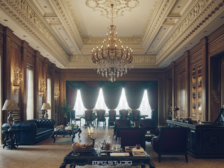 an elegant living room with chandelier, couches and tables in the center