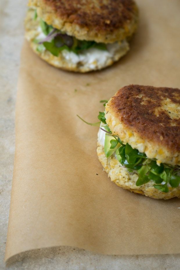 two crab cakes sitting on top of a piece of wax paper next to each other