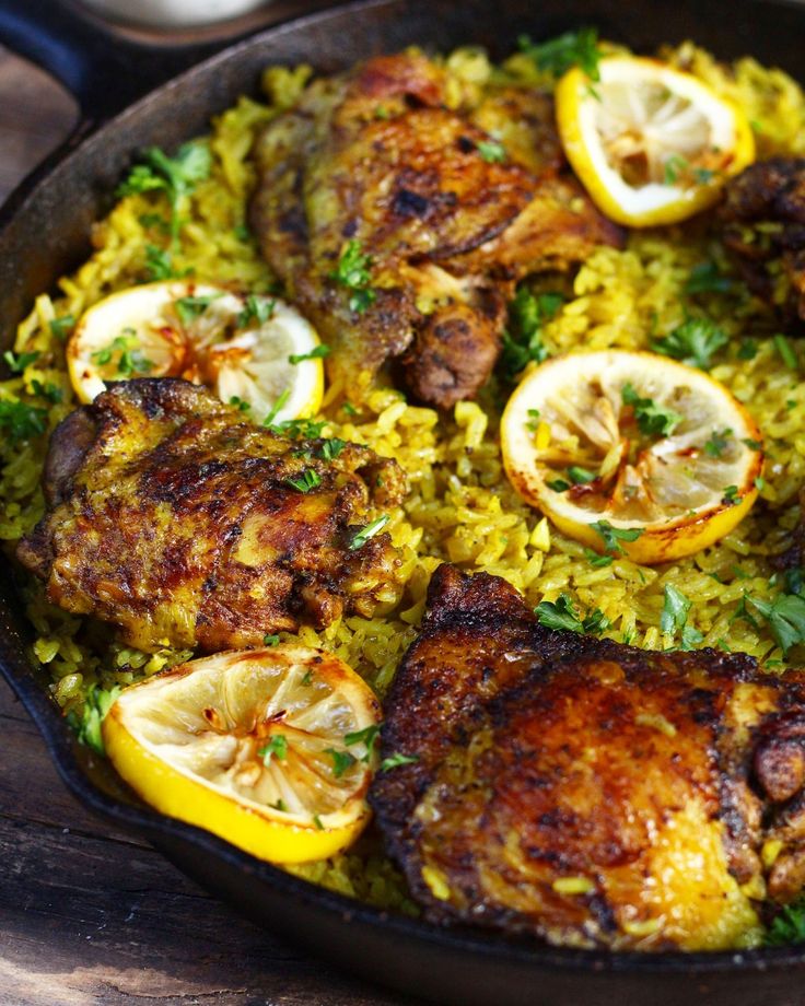 chicken and rice with lemons in a skillet