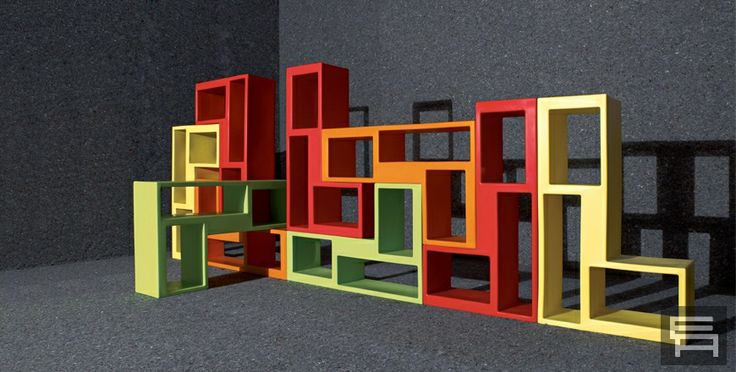 colorful bookshelves are stacked on top of each other in the shape of squares and rectangles