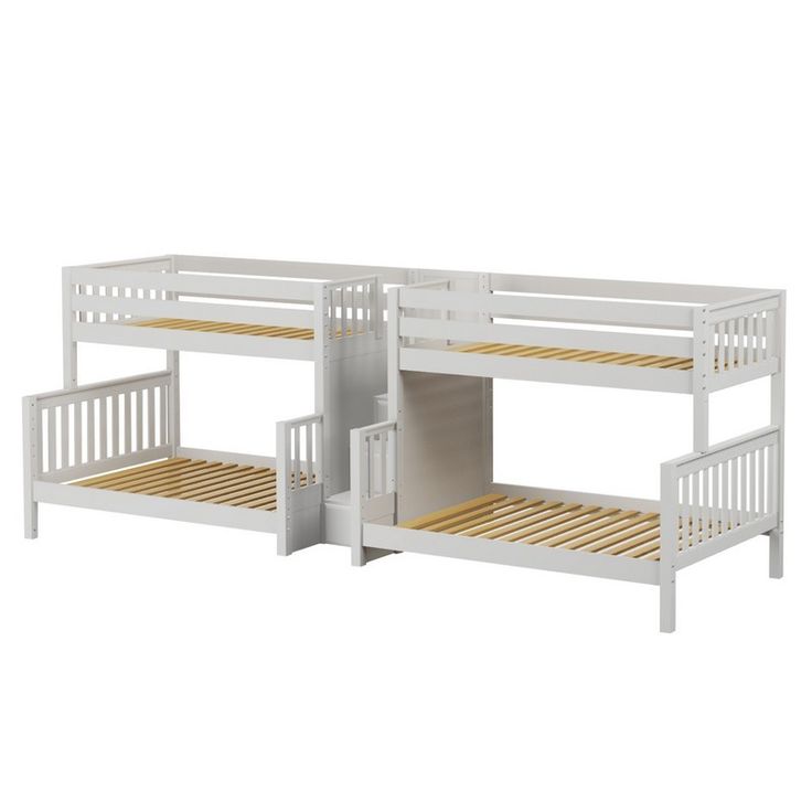 two white bunk beds sitting next to each other