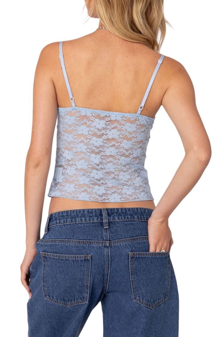 This full-of-charm cami is made from lovely lace that's sheer below the bust and topped with slender adjustable straps. V-neck Adjustable straps 95% polyester, 5% spandex Machine wash, dry flat Imported Lace Camisole With Delicate Detailing, Lace Delicate Camisole, Lace Tank Top With Straps, Lace Cami Top With Built-in Bra, Lace Top With Built-in Bra And Spaghetti Straps, Lace Cami Tank Top With Straps, Lace Tops With Delicate Straps, Lace Tank Top With Delicate Straps, Lace Camisole Top With Delicate Straps