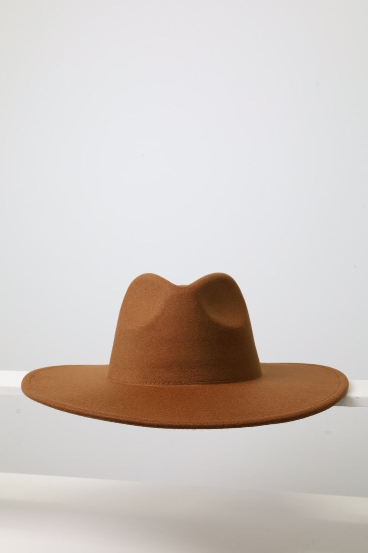 Enhance your style this fall and winter with our large wide brim solid color Fedora - it comes with 18 different colors and its quality and structure of hat for both fashion and functionality. Size: Brim: 4 inches wide Size: Large Hat Size: 7.1/4 - 7. 5/8 Inches: 22.75- 23 CM: 58-59 Key Features: Classic Solid Colors: This plain fedora serves as a blank canvas, allowing you to customize and design it to suit your unique style. Versatile Fashion: The timeless design of this Classic Fedora is perf