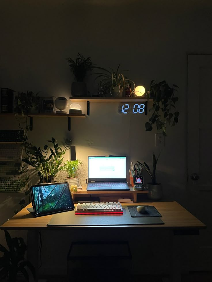 a laptop computer sitting on top of a wooden desk