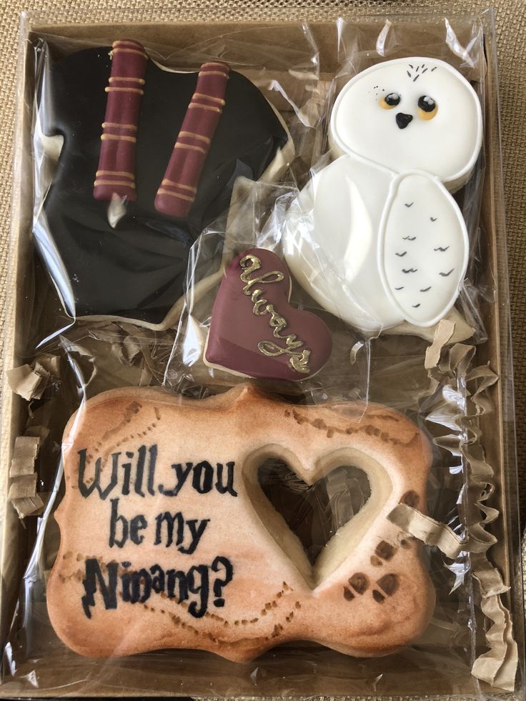 an assortment of cookies in a box with writing on them that says will you be my mommy?