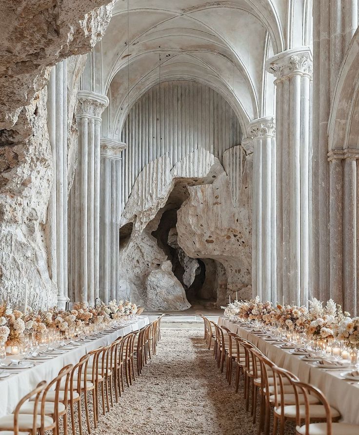 a long table is set up in an old building