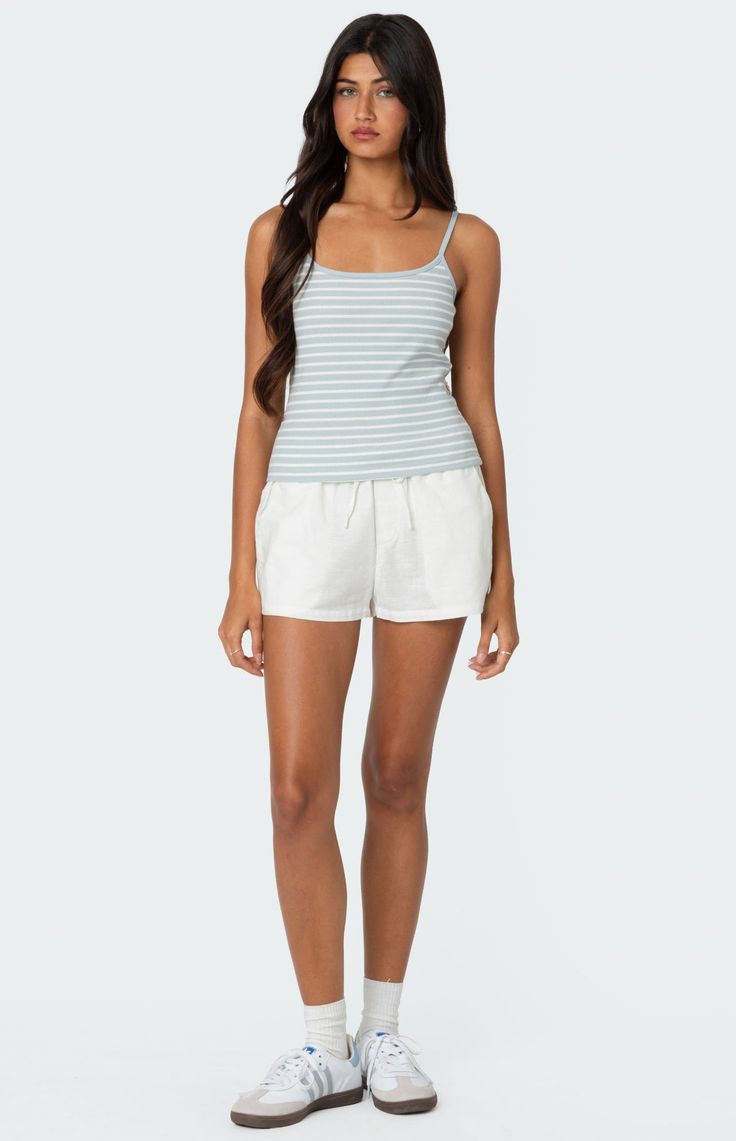 Online only! This striped tank top gives the perfect twist on a closet staple. With its flattering fitted silhouette, it's a versatile piece that will become an instant go-to.


	Tank top
	Adjustable straps
	Striped fabric
	Cotton, Polyester, Spandex
	Model wears size S
	Model height is 5'7
	Item care: Wash with similar color Striped Stretch Tank Top, Striped Stretch Tank Top For Summer, Striped Fitted Tank Top With Tank Straps, Sporty Striped Sleeveless Top, Sporty Sleeveless Striped Tops, Casual Seamless Tank Top For Day Out, Striped Fitted Tops With Tank Straps, Fitted Striped Tops With Tank Straps, Striped Tank Top For Spring