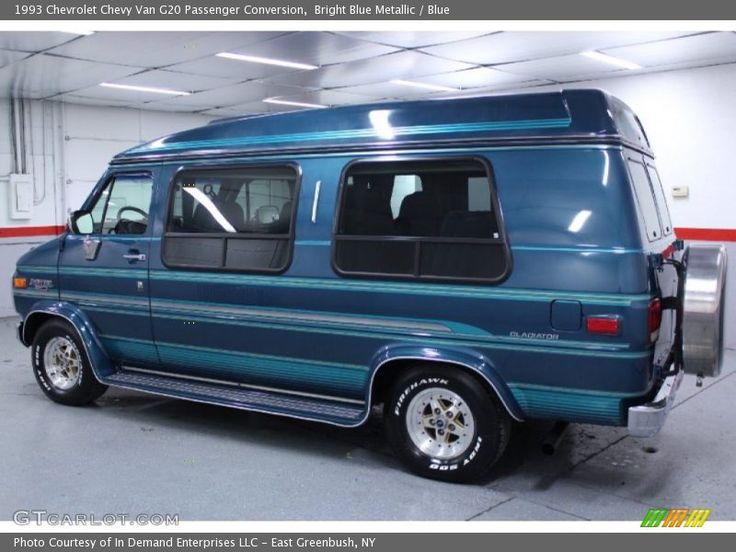 a blue van is parked in a garage