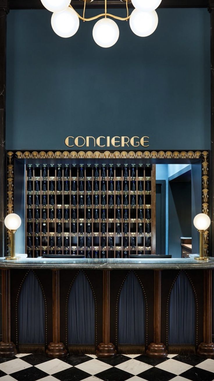 the front desk of a wine cellar with black and white checkered flooring