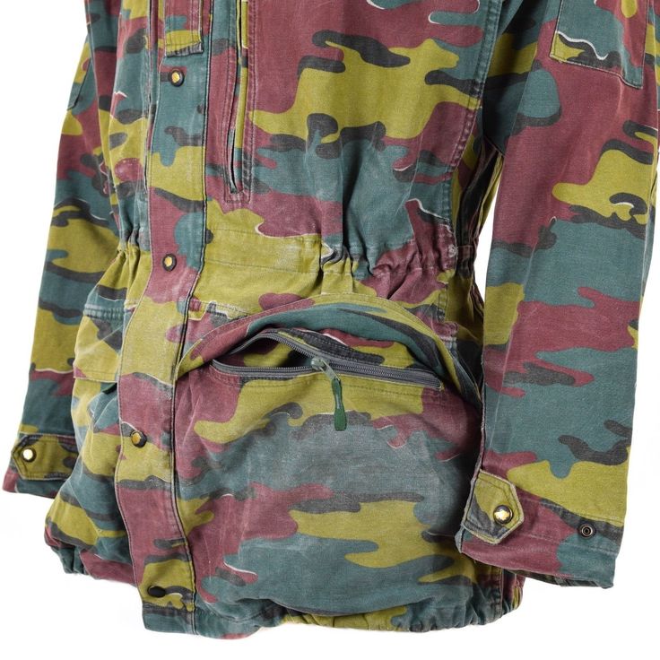 "Belgian jigsaw camouflage field parka The jacket features a zipper and snap fastener closure. Drawstring hem, reinforcing in the elbows and small ventilation holes in the armpits. Six pockets altogether: four front pockets and two sleeve pockets Used condition, may have professional stitched repairs. * Economy shipping Shipping time : 7-21 working days or sometime more * Standard shipping with tracking information Shipping time : 7-14 working days or sometime more Shipping to Australia, New Zea Combat Style Hunting Parka With Pockets, Khaki Military Parka For Hunting, Fall Hunting Combat Utility Jacket, Fall Combat Utility Jacket For Hunting, Military Parka For Hunting In Fall, Military Style Hunting Parka For Fall, Combat Style Camouflage Windbreaker With Pockets, Camouflage Combat Windbreaker With Pockets, Military Parka With Multiple Pockets